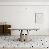 Extendable Sintered Stone Dining Table Seats 8-10 People. Modern Telescopic Dining Table with Leather Base