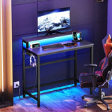 Small Computer Desk with Charging Station and LED Lights, Gaming Desk with Monitor Stand, 2-Tier Home Office Desk, Black