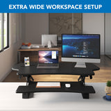Mount-It! Standing Desk Converter, 48" Wide Sit Stand Desk Riser with Dual Gas Spring Handles