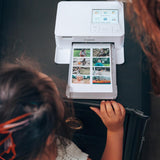 Canon Selphy CP1500 Photo Printer Bundle (White) with KP-108 Paper (108 Sheets) 3 Color Ink Cartridges & Tudak Cleaning Cloth – Wireless