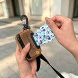 Cute Dog Poop Bag Holder with Hook-and-Loop Attachment, Double Layer Fabric Waste Bag Dispenser for Leashes, Includes Starter Roll for Easy Pet Cleanup (Brown)