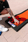 PutterBall Original Golf Putting Game Set – Backyard Putting Green Pong Style Golf Mat with 2 Putters, 2 Balls & Hole Covers - Red, 9ft