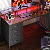 47 Inch Computer Desk with Builtin Power Outlets and Ambient LED Lights for Gaming and Office Use