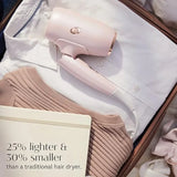 Travel-use lightweight hair dryer with ergonomic design, black color, fast drying and frizz smoothing