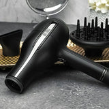 Travel hair dryer for fast drying with even heating, black gold finish, 2000W dual voltage,