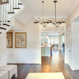 10-Light Matte Black Adjustable Chandelier with Smoked Glass Globe Shades Mid
